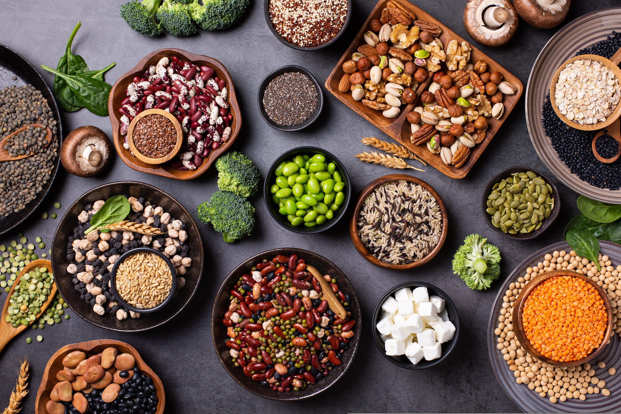 Assorted nuts, seeds, and legumes on table.