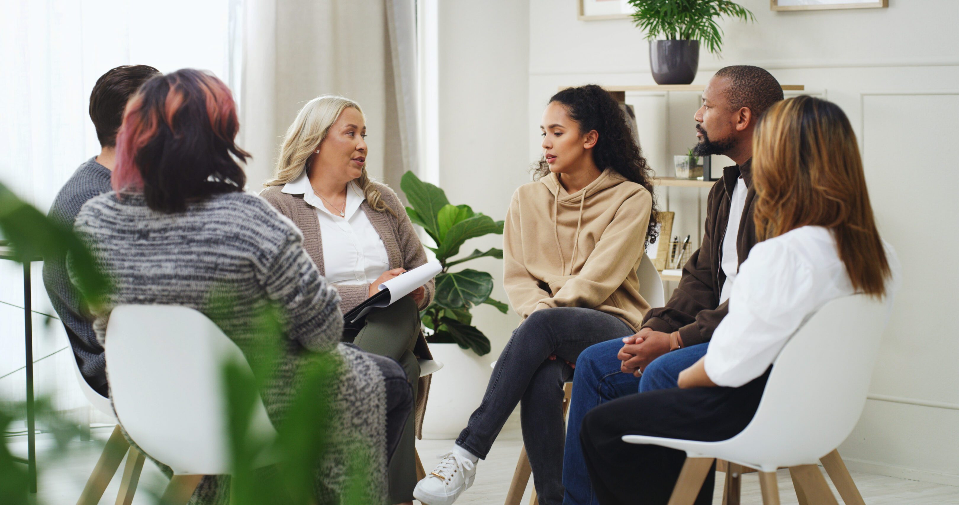 Group discussion in a seated circle setting.