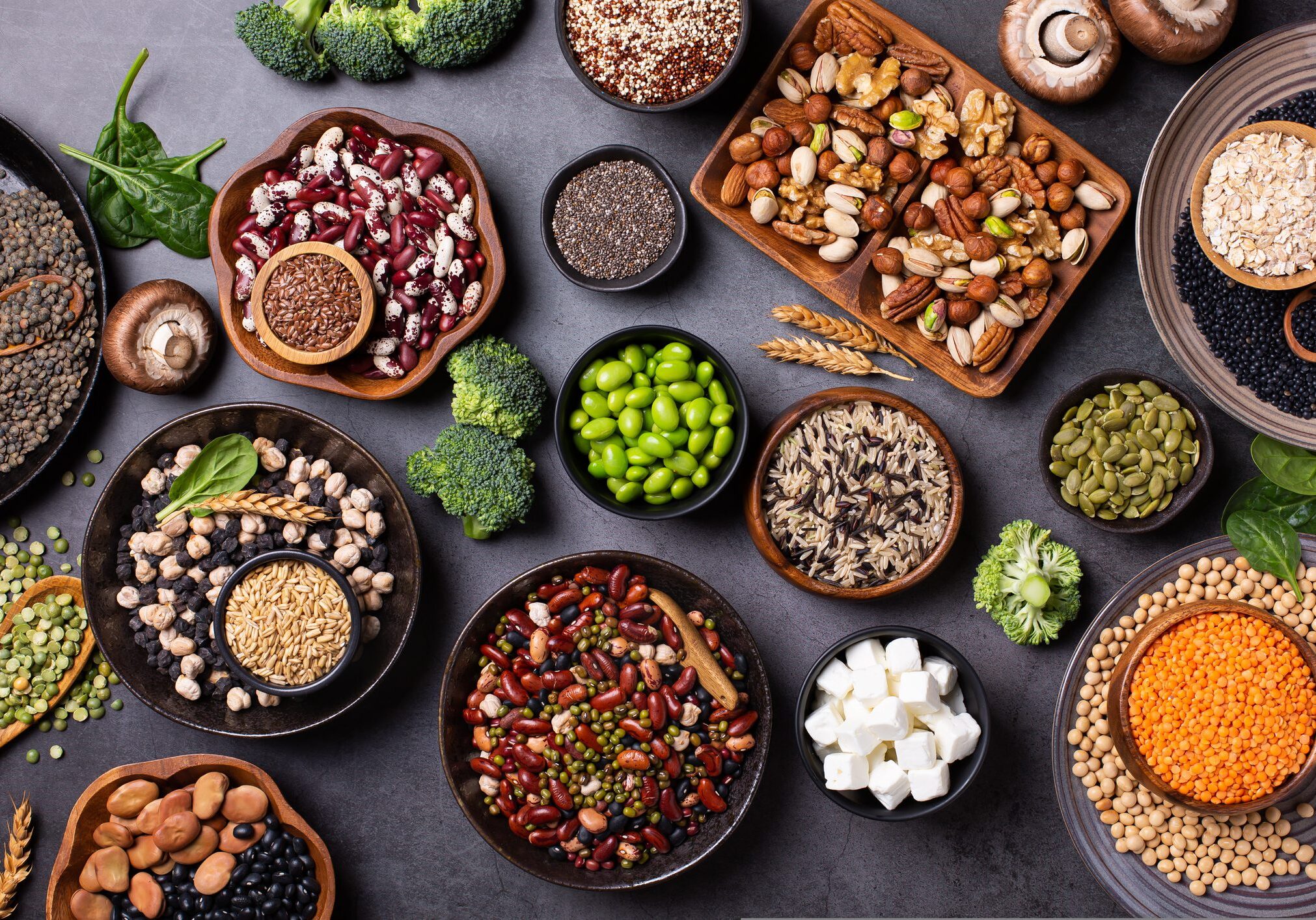 Assorted nuts, seeds, and legumes on table.